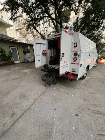 Magnet Plumbing service vehicle on-site for Grease Trap Cleaning in Palmer